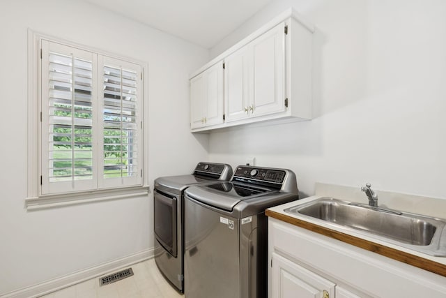 1524 Gordon Petty Dr, Brentwood, TN 37027 - laundry room featuring washer and clothes dryer and cabinet space