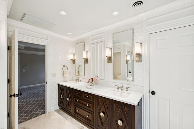 1524 Gordon Petty Dr, Brentwood, TN 37027 - bathroom featuring crown molding, double vanity, and recessed lighting