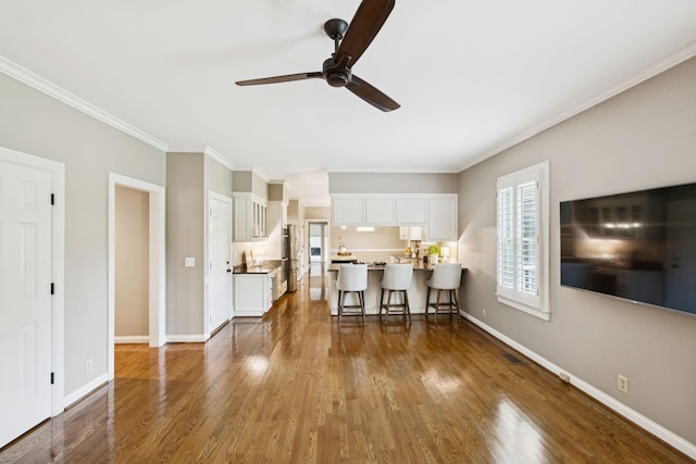 1524 Gordon Petty Dr, Brentwood, TN 37027 - living area featuring a ceiling fan, dark wood-style floors, and ornamental molding