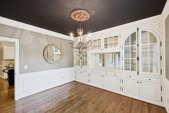 1524 Gordon Petty Dr, Brentwood, TN 37027 - unfurnished dining area featuring a chandelier, dark wood-style flooring, a wainscoted wall, and crown molding