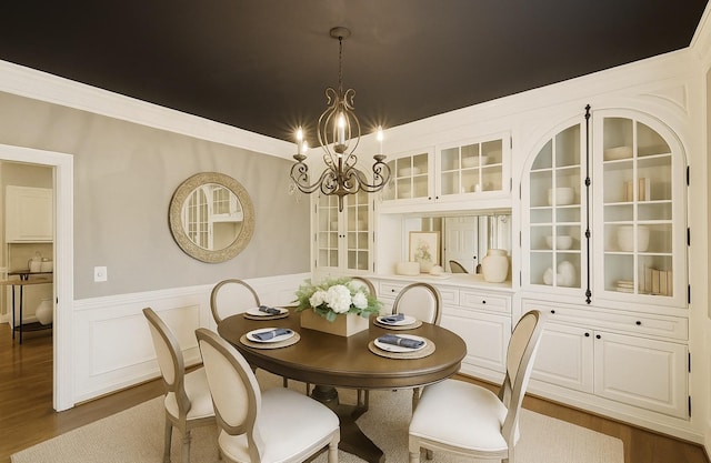 1524 Gordon Petty Dr, Brentwood, TN 37027 - dining area featuring a chandelier, a wainscoted wall, dark wood-style floors, and ornamental molding