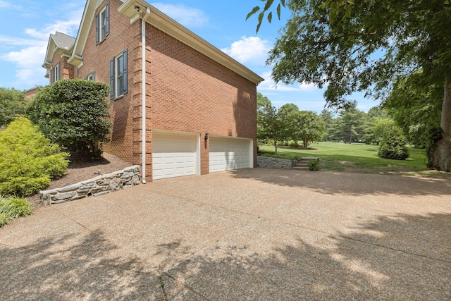 1524 Gordon Petty Dr, Brentwood, TN 37027 - view of side of property featuring brick siding, driveway, and a garage