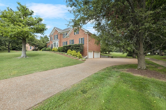 1524 Gordon Petty Dr, Brentwood, TN 37027 - view of front facade featuring brick siding, driveway, a front yard, and an attached garage