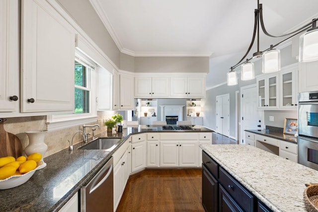 1524 Gordon Petty Dr, Brentwood, TN 37027 - kitchen with appliances with stainless steel finishes, white cabinets, crown molding, dark wood-type flooring, and glass insert cabinets