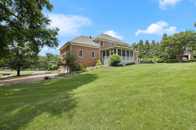 1524 Gordon Petty Dr, Brentwood, TN 37027 - view of property exterior featuring a sunroom, brick siding, a lawn, and a garage