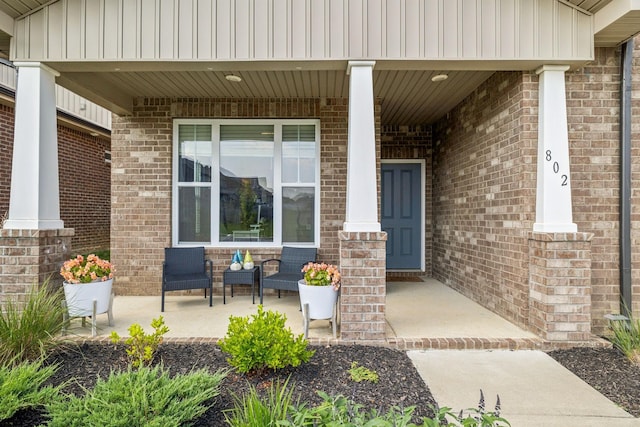 802 Carnation Dr, Smyrna, TN 37167 - property entrance featuring a porch and brick siding