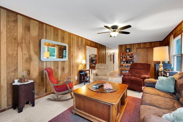 105 Plain View Dr, Estill Springs, TN 37330 - living room with wooden walls, ceiling fan, and light colored carpet
