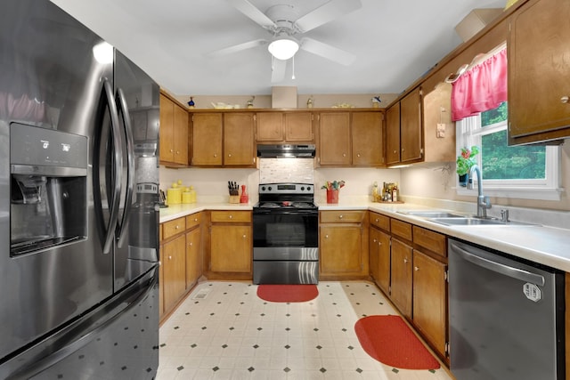 105 Plain View Dr, Estill Springs, TN 37330 - kitchen with stainless steel appliances, brown cabinetry, light countertops, and ceiling fan