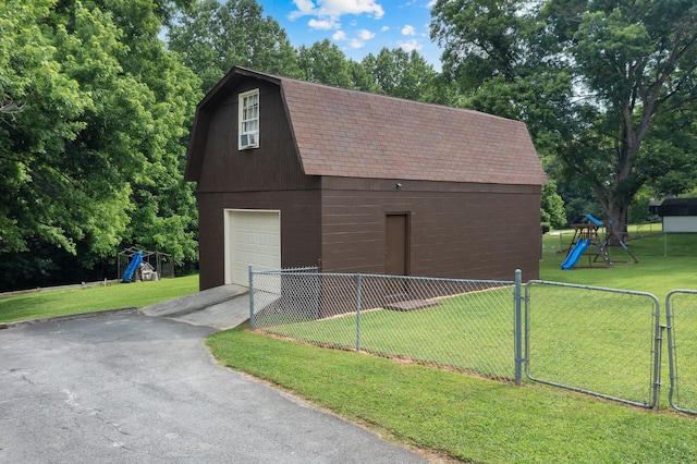 105 Plain View Dr, Estill Springs, TN 37330 - garage with a detached garage, driveway, view of wooded area, and a gate