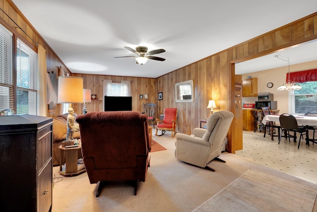 105 Plain View Dr, Estill Springs, TN 37330 - living room featuring healthy amount of natural light, wooden walls, a ceiling fan, light carpet, and crown molding