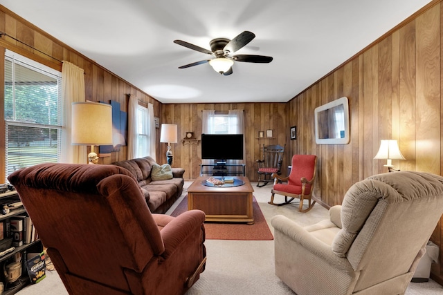 105 Plain View Dr, Estill Springs, TN 37330 - living room featuring wood walls, light colored carpet, healthy amount of natural light, and a ceiling fan