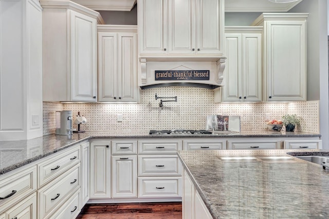 2811 Craythorne Dr, Murfreesboro, TN 37129 - kitchen with premium range hood, ornamental molding, backsplash, stainless steel gas stovetop, and stone counters