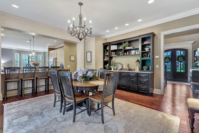 2811 Craythorne Dr, Murfreesboro, TN 37129 - dining room with a chandelier, wood finished floors, ornamental molding, recessed lighting, and french doors