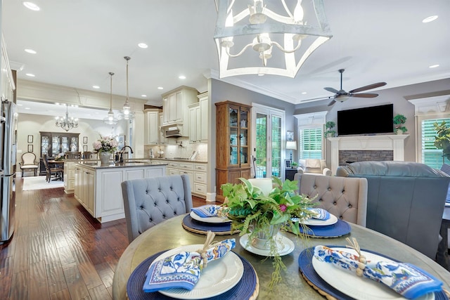 2811 Craythorne Dr, Murfreesboro, TN 37129 - dining area featuring ceiling fan, ornamental molding, plenty of natural light, a chandelier, and a fireplace