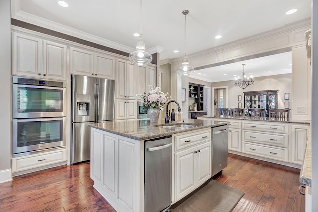 2811 Craythorne Dr, Murfreesboro, TN 37129 - kitchen with stainless steel appliances, white cabinetry, crown molding, a center island with sink, and dark wood-style floors