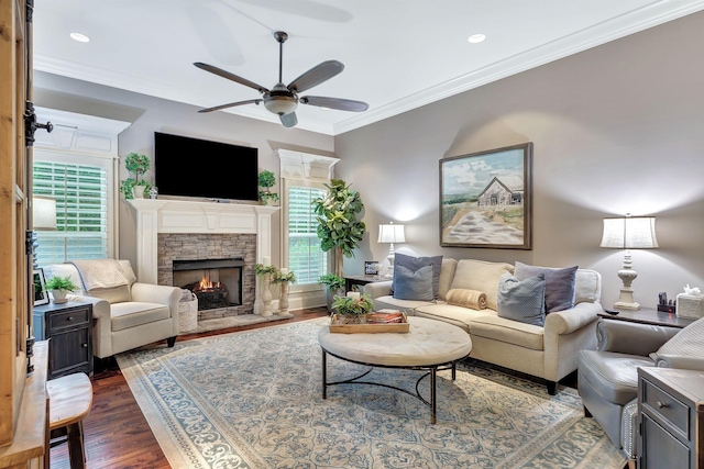 2811 Craythorne Dr, Murfreesboro, TN 37129 - living room featuring dark wood finished floors, ceiling fan, a stone fireplace, ornamental molding, and recessed lighting