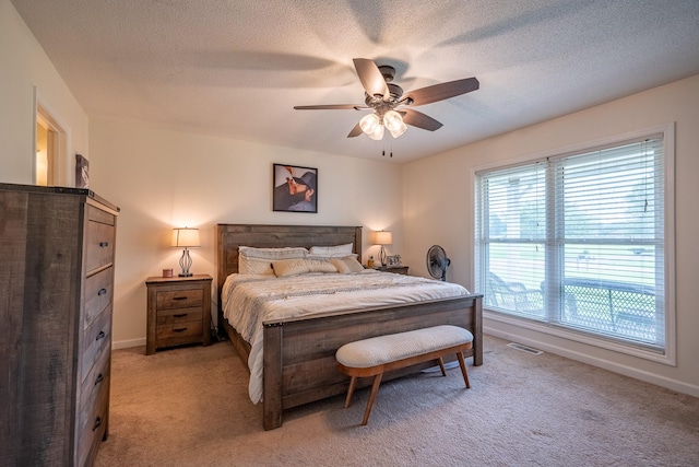 545 Kent St, Lawrenceburg, TN 38464 - bedroom with light colored carpet, a textured ceiling, and a ceiling fan