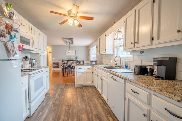 545 Kent St, Lawrenceburg, TN 38464 - kitchen featuring white appliances, ceiling fan, a peninsula, dark wood-style floors, and white cabinetry
