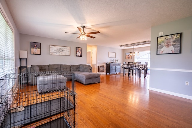 545 Kent St, Lawrenceburg, TN 38464 - living area with light wood-style flooring, a chandelier, and ceiling fan