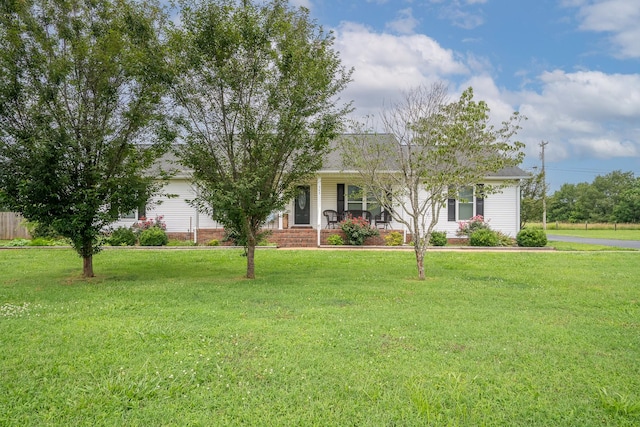 545 Kent St, Lawrenceburg, TN 38464 - view of property hidden behind natural elements with a front lawn, covered porch, and an attached garage