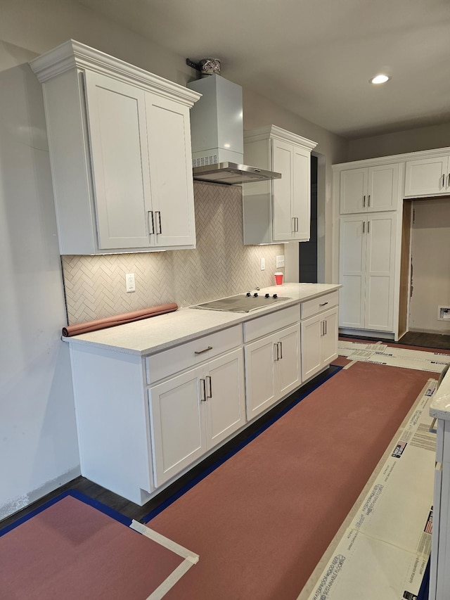 2895 Cooper Creek Rd, Woodlawn, TN 37191 - kitchen featuring electric cooktop, wall chimney range hood, decorative backsplash, white cabinetry, and recessed lighting