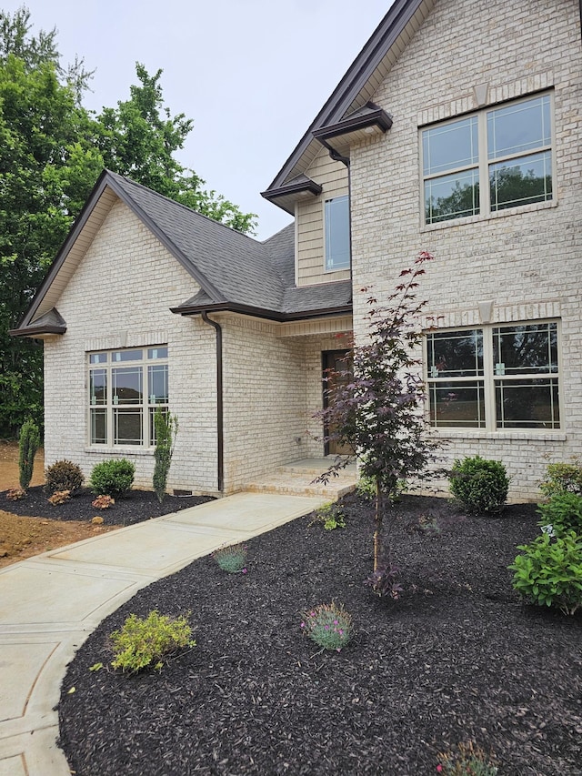 2895 Cooper Creek Rd, Woodlawn, TN 37191 - view of front facade with brick siding and roof with shingles