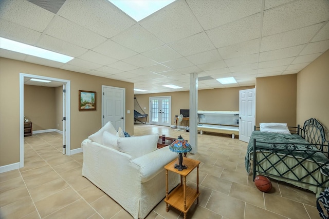 5546 Old Kentucky Rd, Byrdstown, TN 38549 - living area with a paneled ceiling, stairs, light tile patterned flooring, and french doors