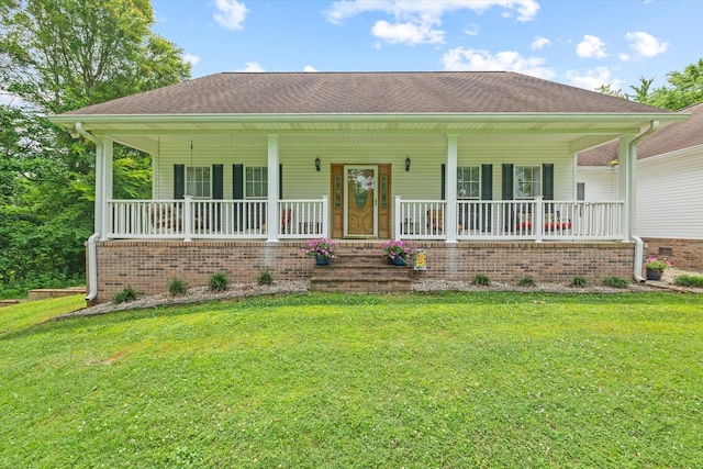 5546 Old Kentucky Rd, Byrdstown, TN 38549 - view of front of house with covered porch, a front yard, and a shingled roof