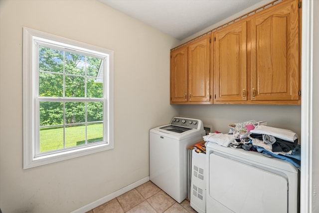 5546 Old Kentucky Rd, Byrdstown, TN 38549 - laundry room featuring cabinet space, plenty of natural light, light tile patterned floors, and separate washer and dryer