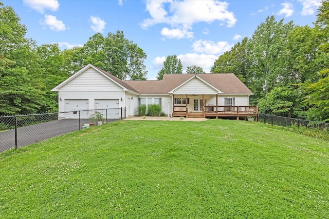5546 Old Kentucky Rd, Byrdstown, TN 38549 - ranch-style house featuring asphalt driveway, a wooden deck, a garage, a fenced backyard, and french doors