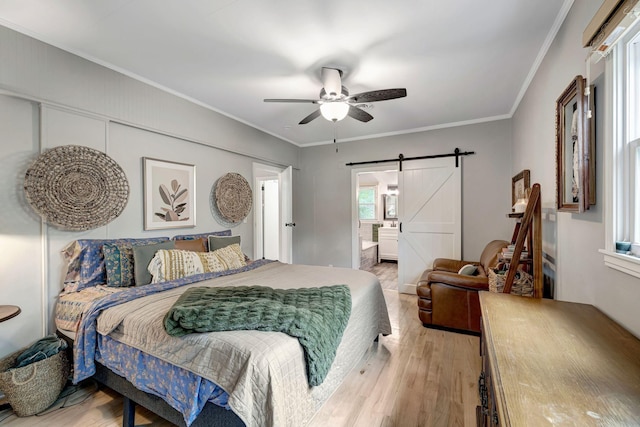 1519 Graybar Ln, Murfreesboro, TN 37129 - bedroom featuring a barn door, light wood-type flooring, crown molding, ceiling fan, and connected bathroom