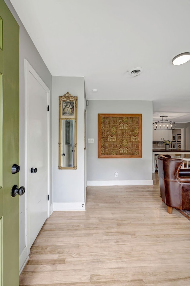 1519 Graybar Ln, Murfreesboro, TN 37129 - corridor featuring a chandelier and light wood-style floors