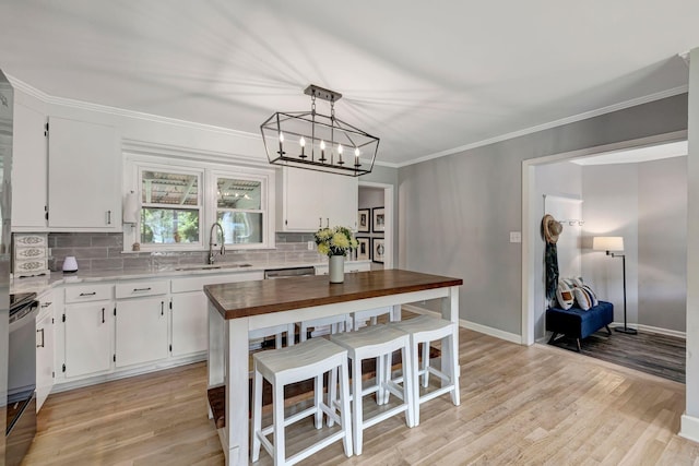 1519 Graybar Ln, Murfreesboro, TN 37129 - kitchen with butcher block counters, backsplash, stove, a chandelier, and white cabinets