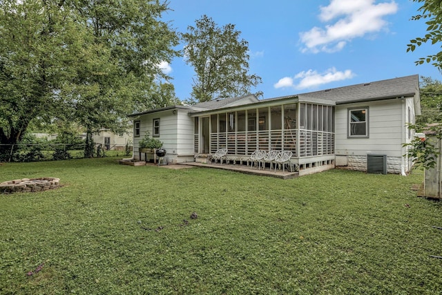 1519 Graybar Ln, Murfreesboro, TN 37129 - back of house with a sunroom, a fire pit, and roof with shingles