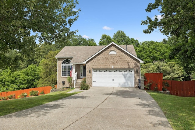 7607 Birdsong Ct, Fairview, TN 37062 - view of front facade featuring brick siding, a garage, concrete driveway, and roof with shingles