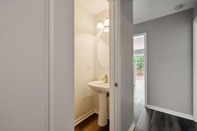 7607 Birdsong Ct, Fairview, TN 37062 - bathroom featuring baseboards and wood finished floors