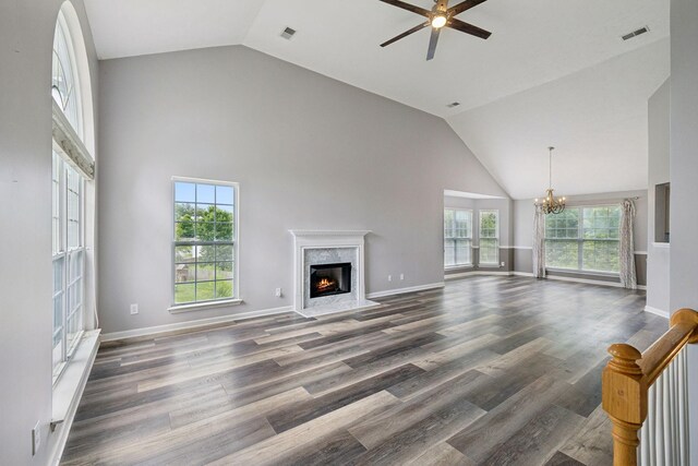7607 Birdsong Ct, Fairview, TN 37062 - unfurnished living room featuring a fireplace, a ceiling fan, a chandelier, high vaulted ceiling, and dark wood-style floors