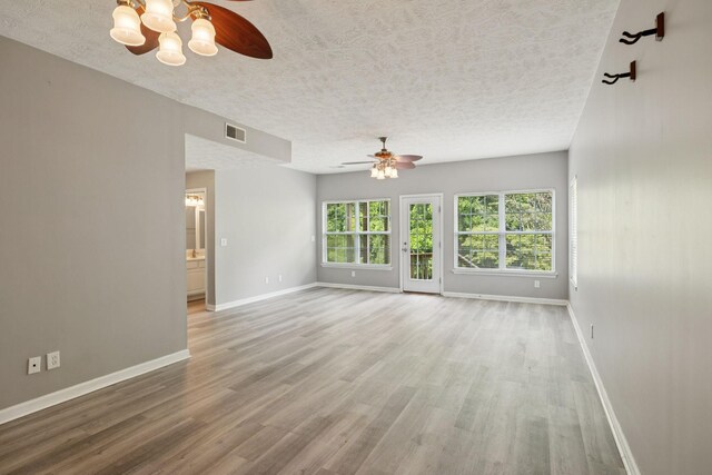 7607 Birdsong Ct, Fairview, TN 37062 - unfurnished room with a ceiling fan, a textured ceiling, and wood finished floors