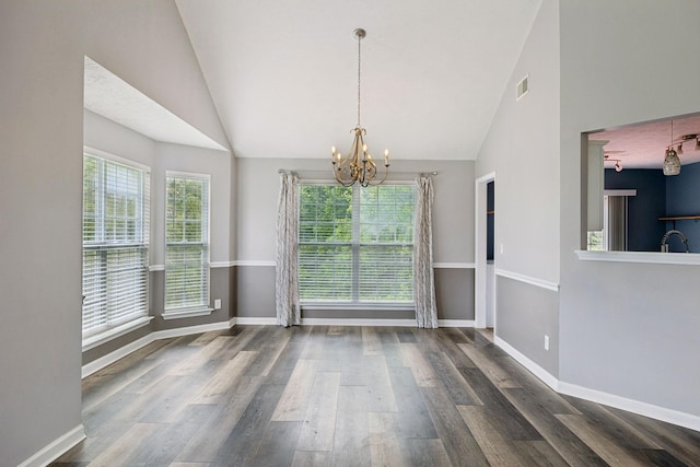 7607 Birdsong Ct, Fairview, TN 37062 - unfurnished dining area featuring a chandelier, vaulted ceiling, plenty of natural light, and wood finished floors