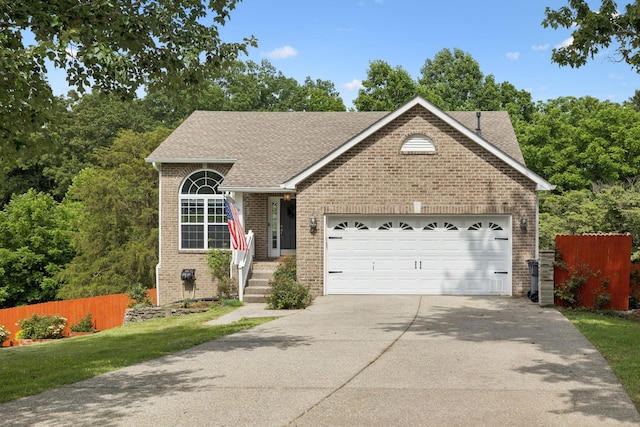7607 Birdsong Ct, Fairview, TN 37062 - view of front of home with brick siding, an attached garage, concrete driveway, and roof with shingles