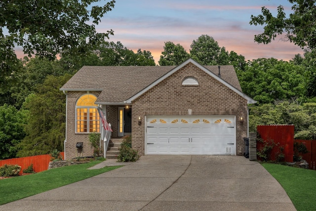 7607 Birdsong Ct, Fairview, TN 37062 - view of front facade featuring driveway, brick siding, roof with shingles, and a garage
