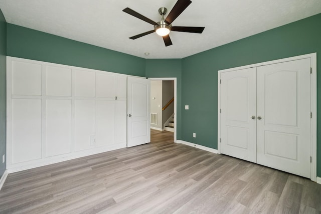 7607 Birdsong Ct, Fairview, TN 37062 - unfurnished bedroom with light wood-style flooring, a closet, and ceiling fan