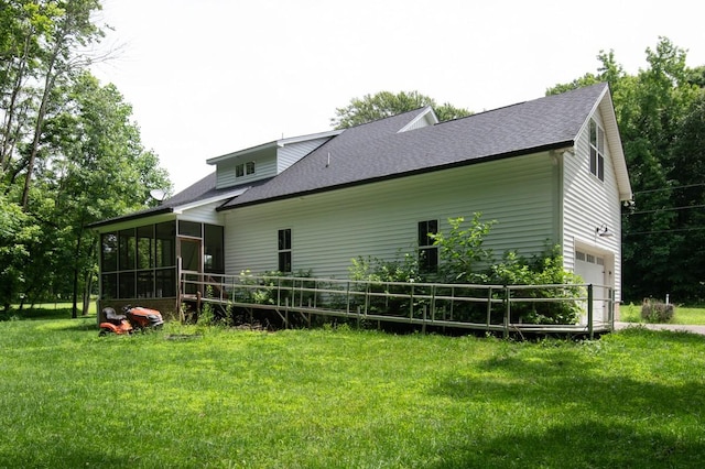 4486 Beards Chapel Rd, Springfield, TN 37172 - rear view of property with a sunroom, a shingled roof, a yard, and an attached garage