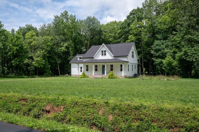 4486 Beards Chapel Rd, Springfield, TN 37172 - view of front facade featuring a porch, a front lawn, and a view of trees
