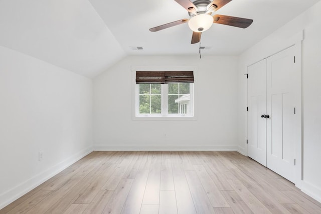 4486 Beards Chapel Rd, Springfield, TN 37172 - unfurnished bedroom featuring vaulted ceiling, light wood-style flooring, ceiling fan, and a closet