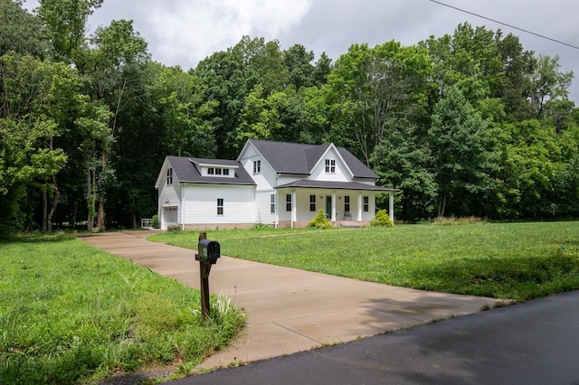 4486 Beards Chapel Rd, Springfield, TN 37172 - view of front of property featuring a porch, a front lawn, driveway, and a forest view