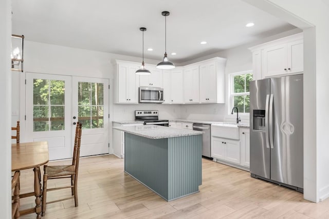 4486 Beards Chapel Rd, Springfield, TN 37172 - kitchen with stainless steel appliances, white cabinetry, a kitchen island, and recessed lighting