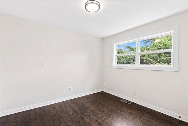 610 Maple Ln, Chattanooga, TN 37411 - empty room with baseboards and dark wood-style flooring