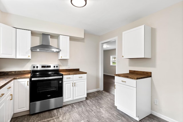 610 Maple Ln, Chattanooga, TN 37411 - kitchen featuring electric stove, wall chimney exhaust hood, butcher block countertops, and white cabinetry