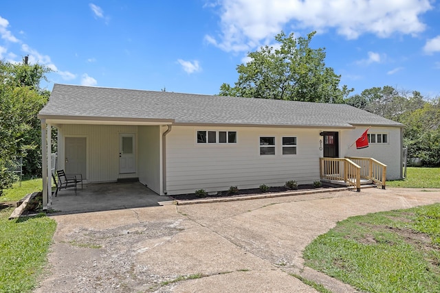610 Maple Ln, Chattanooga, TN 37411 - ranch-style house featuring concrete driveway, an attached carport, and a shingled roof
